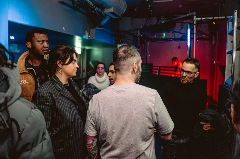 A group of people standing in a room
